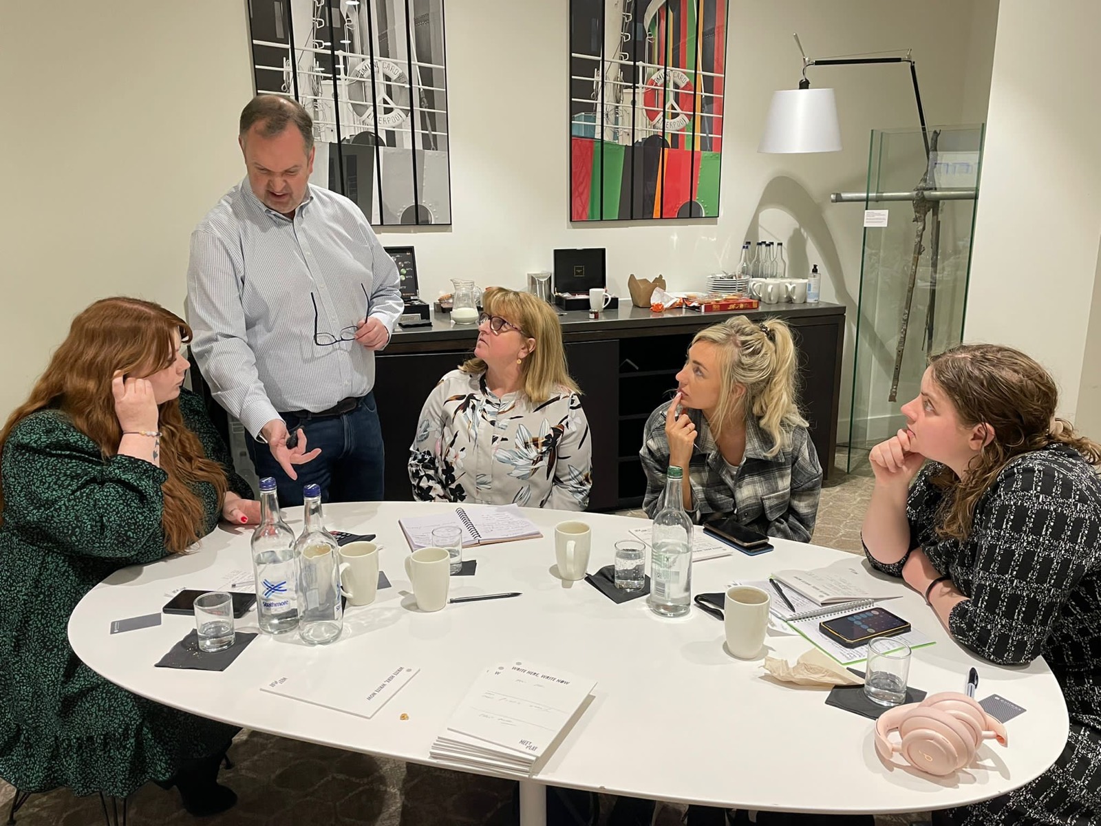 Richard Bartlett delivering a workshop to a small group around a table