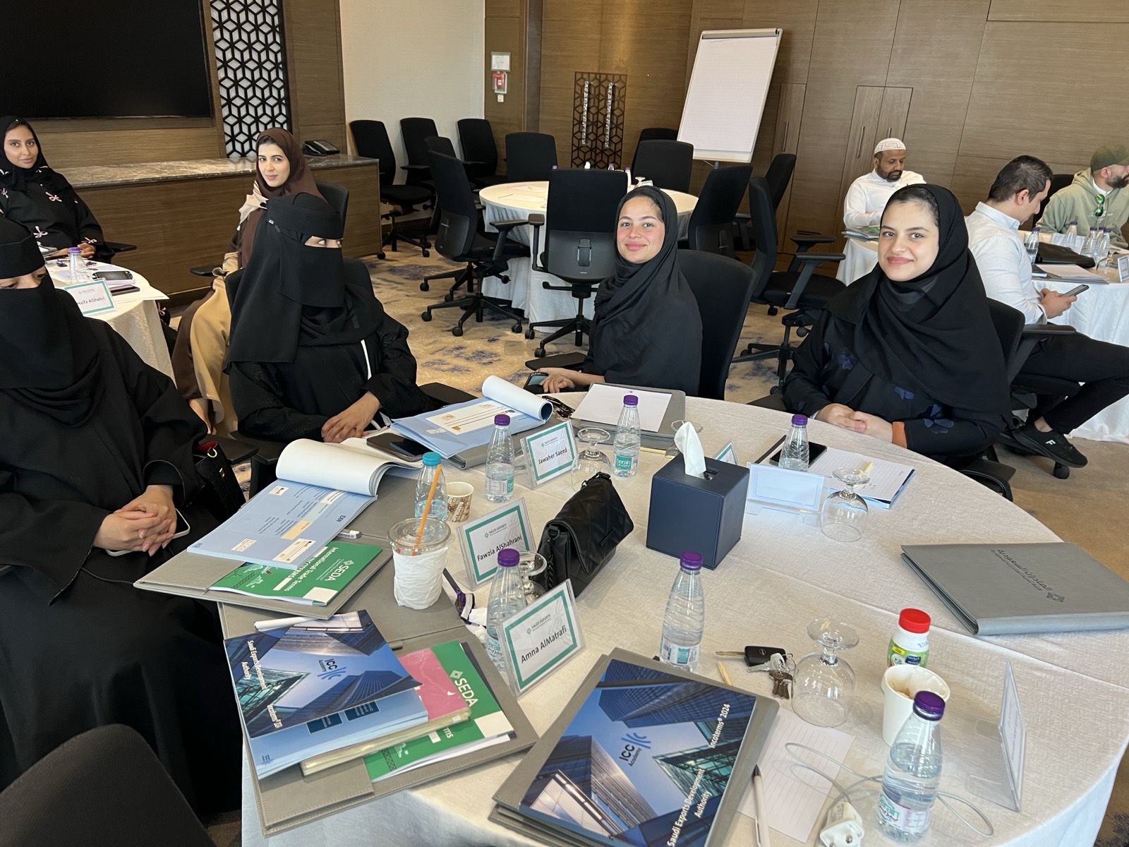 Delegates at an Incoterms 2024 workshop in Riyadh with ICC Academy course materials on the table